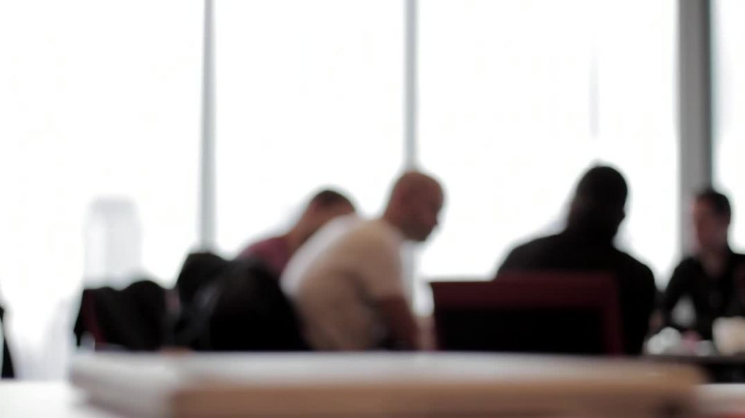 Stock business video of blurred people at a meeting talking